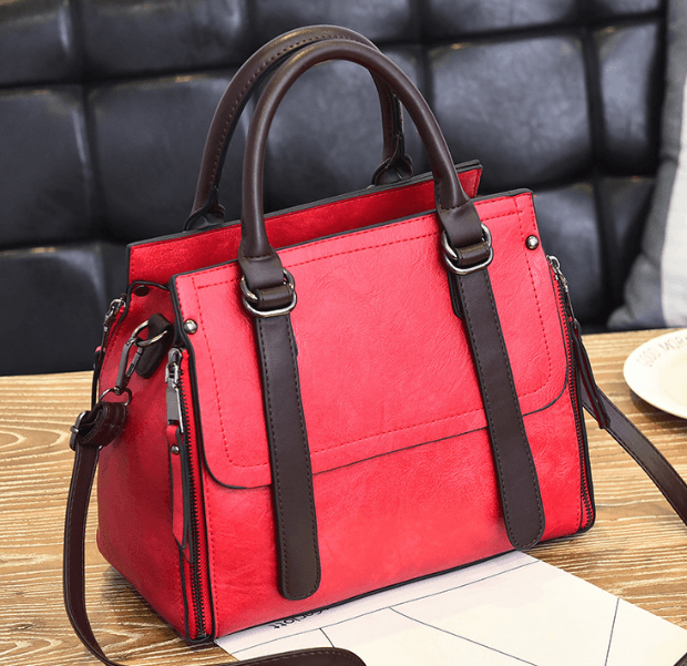 Frosted Handbag, Bucket Bag, Crossbody Bag, Tote Bag in stylish red faux suede with brown accents.