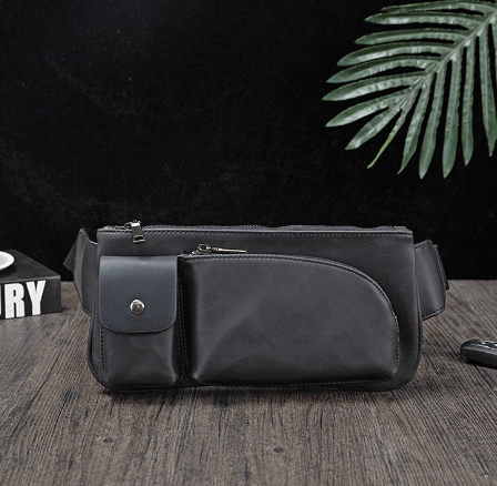Versatile waist bag in black PU leather, featuring multiple pockets and a sleek design for stylish functionality.
