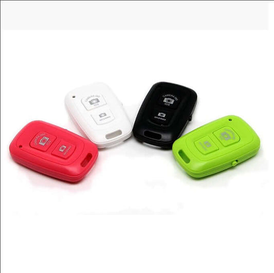 Bluetooth Remote Shutter for iOS and Android Devices in red, white, black, and green colors.