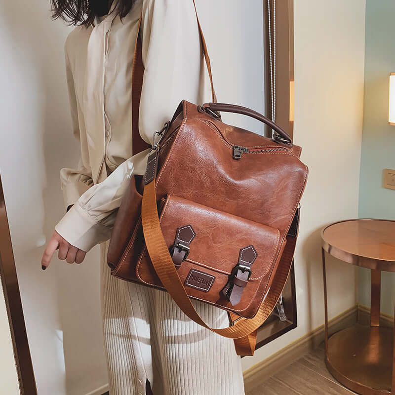 Trendy vintage women's PU leather backpack in brown, perfect for stylish travel and everyday use.