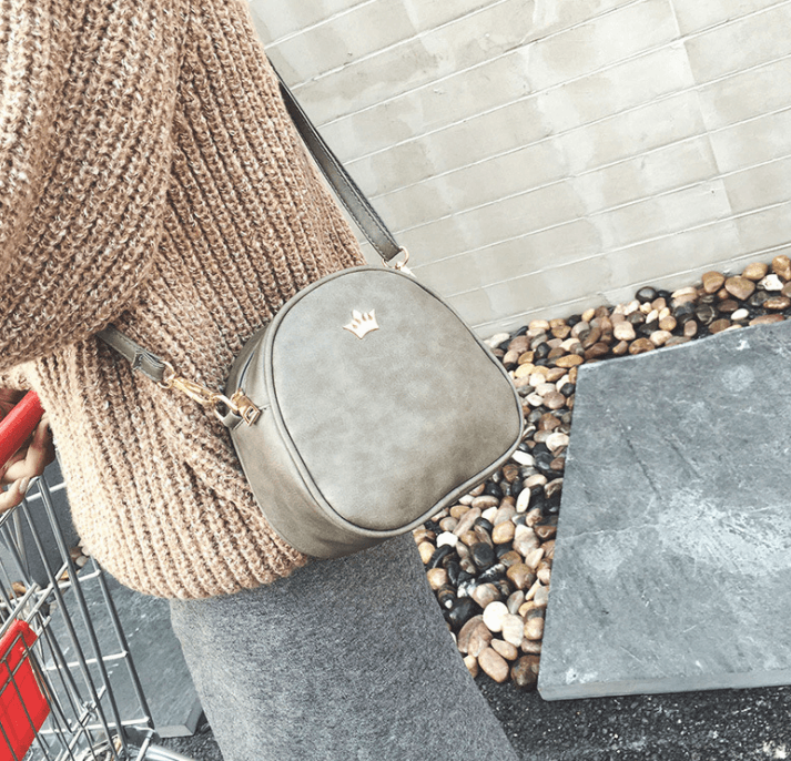 Chic crossbody shoulder bag worn with a cozy sweater, perfect accessory for daily adventures.