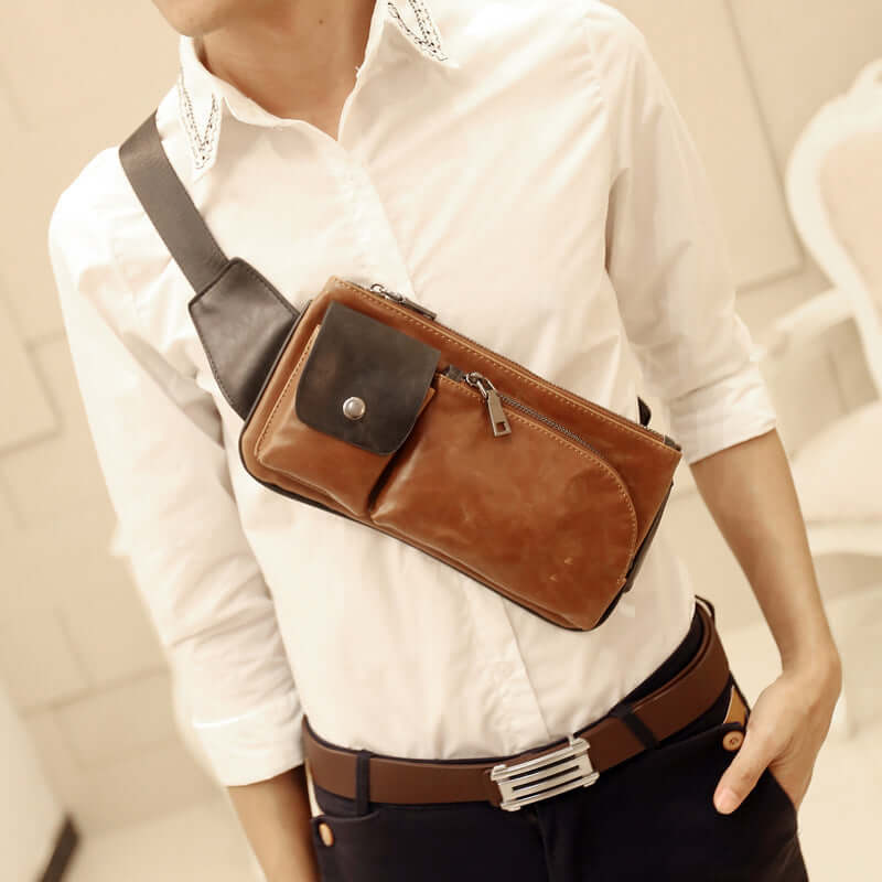 Man wearing a single-shoulder chest bag with a stylish retro design while dressed in a casual outfit.