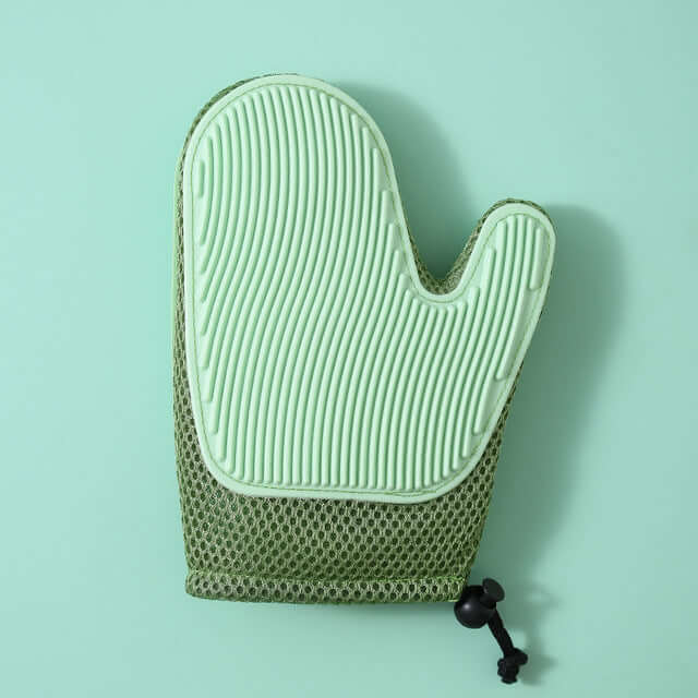 Silicone massage gloves for pet grooming, featuring a soft green design and a textured surface for effective grooming.