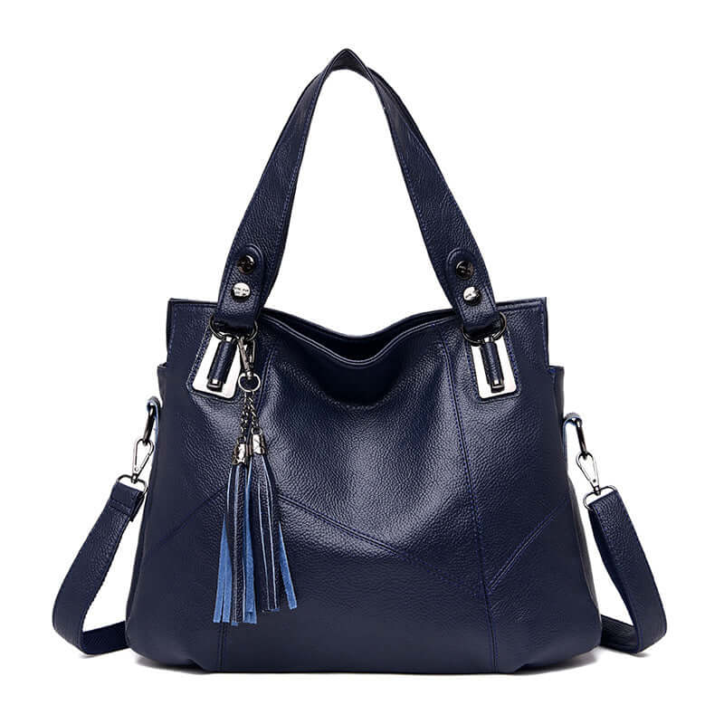 Fashionable large leather shoulder bag for women in navy with tassel detail and dual straps.