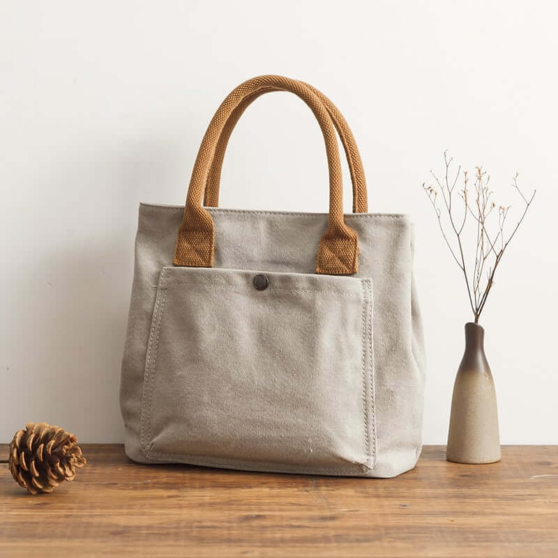 Japanese Korean fashion handbag in light gray canvas with brown straps, perfect for style and functionality.