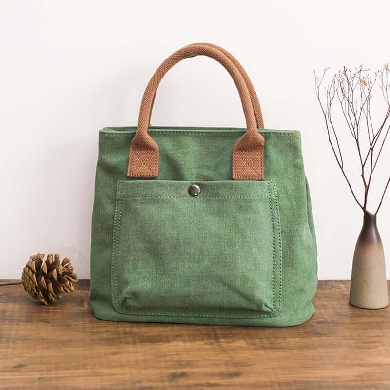 Japanese Korean fashion handbag in green canvas with brown handles, perfect for stylish everyday use.