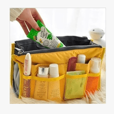 Storage Bag, Inner Bag, Makeup Bag, Organizer Bag with cosmetics, travel essentials, and accessories in a stylish yellow design.