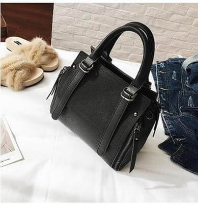Faux suede bucket bag in black showcasing elegance and functionality, perfect for any occasion.