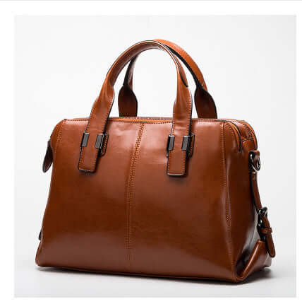Fashionable Women's Leather Motorcycle Shoulder Bag in rich brown leather with dual handles.