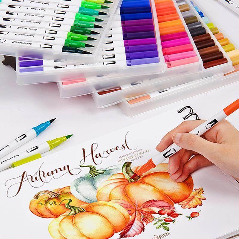 48/72/100 Color Dual-Head Soft Watercolor Pen Set in use for autumn illustration with vibrant pumpkins.