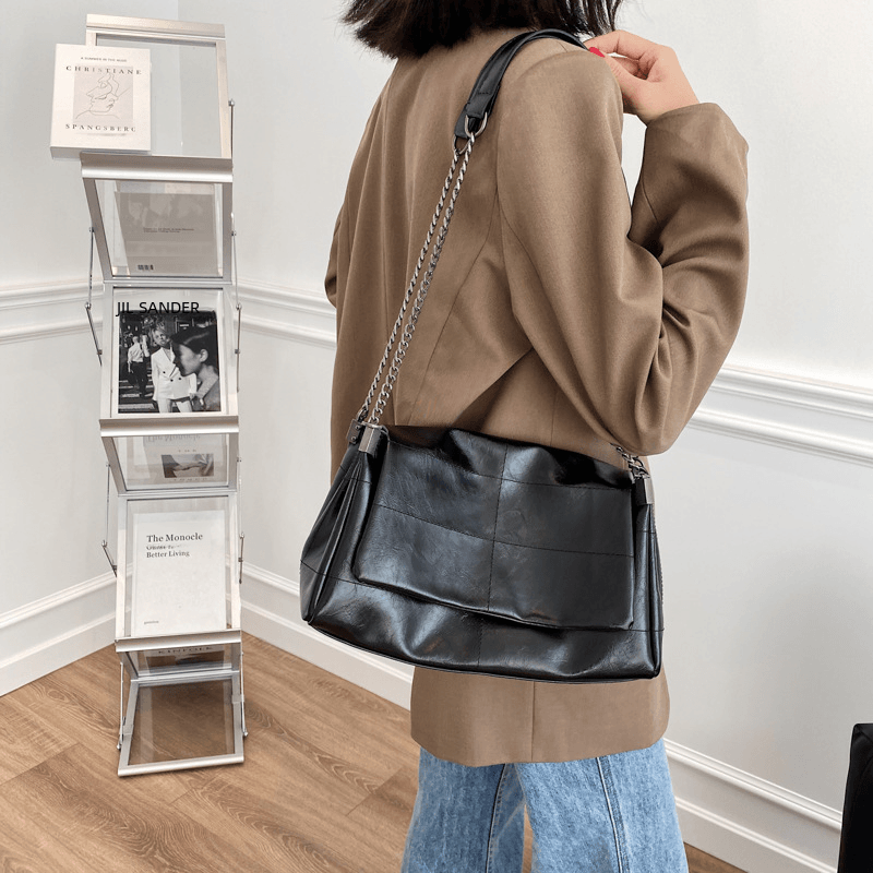 Fashionable PU Leather Small Square Bag for Women showcased with a stylish outfit in a modern setting.