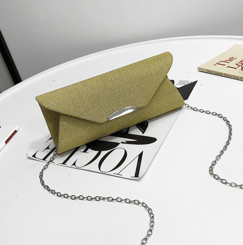 Evening Bag, Clutch, Party Bag, Crossbody Bag on a stylish table with fashion magazines.