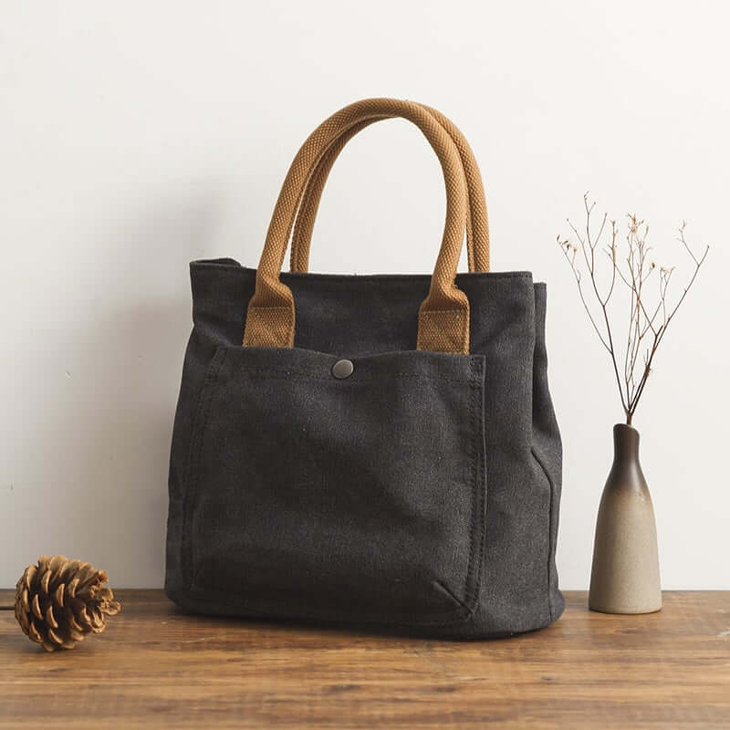 Stylish Japanese Korean fashion handbag made of canvas with zipper closure and practical design.