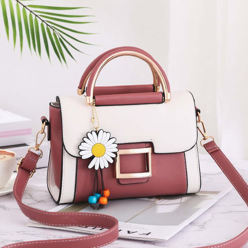 Stylish women's crossbody bag featuring a chic design with a daisy charm and high-quality PU material.