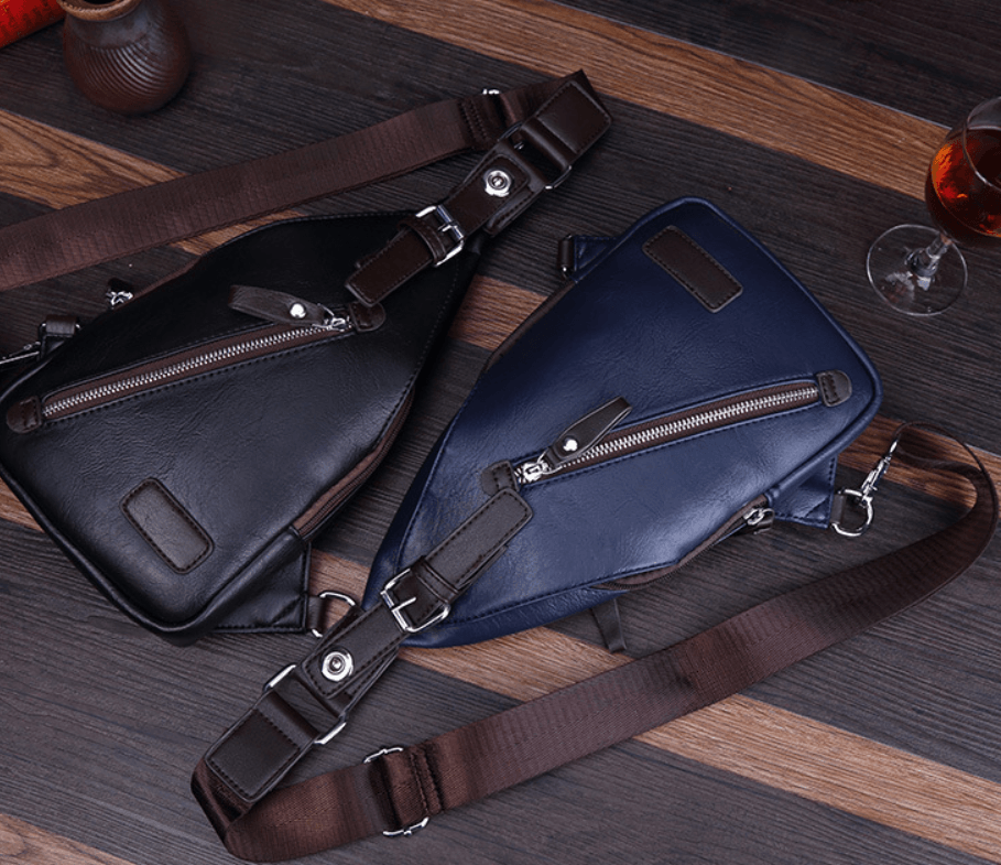 Chest Bag, Waist Bag, Shoulder Bag, Crossbody Bag in black and navy PU leather on a wooden table.