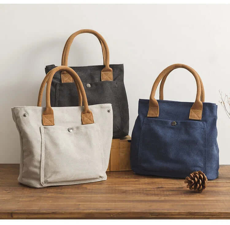 Japanese Korean fashion handbag in three stylish colors: gray, black, and navy with leather handles.