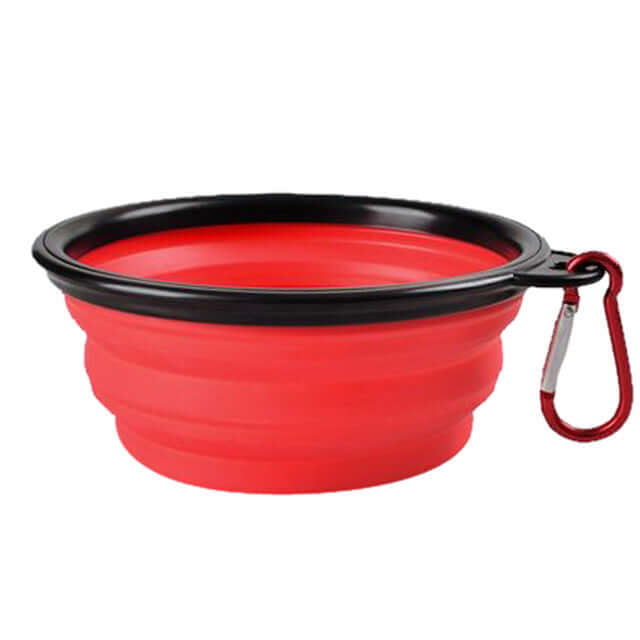 Collapsible Pet Bowl in red, made of silicone with a black rim and carabiner for easy portability.
