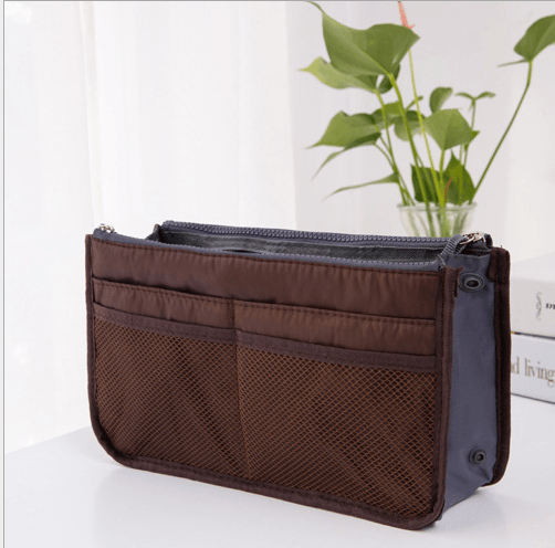 Storage Bag, Inner Bag, Makeup Bag, Organizer Bag displayed on a table with green plants in the background.