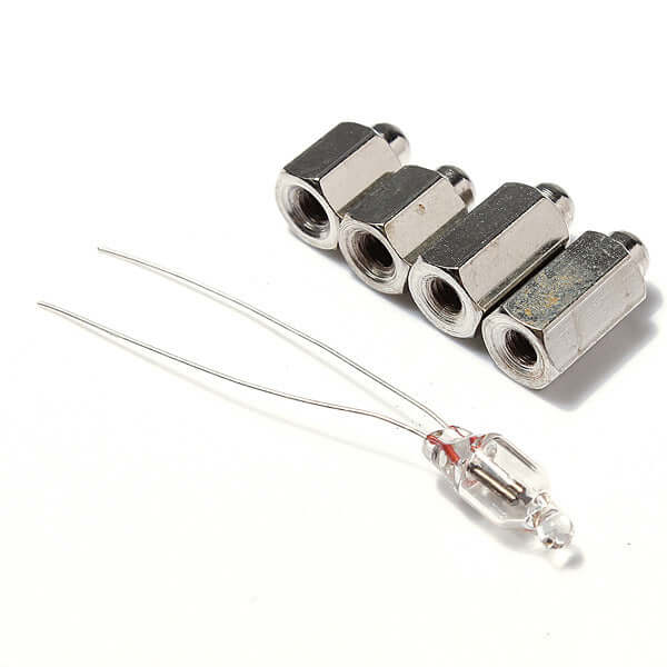 Various metal nuts and a glass bulb with wires, suitable for electrical projects and repairs.