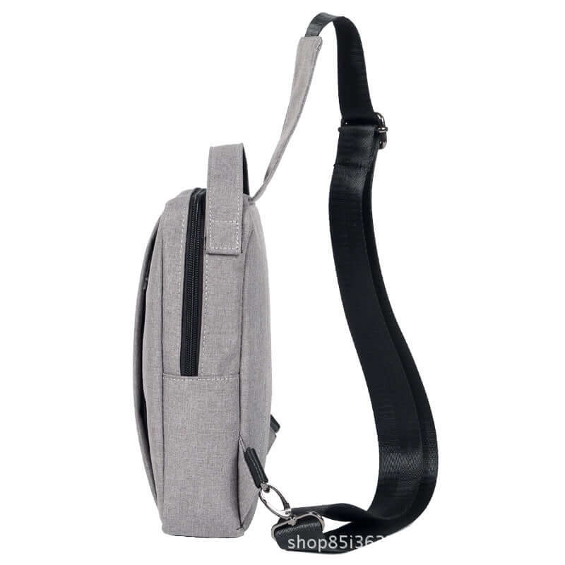 Side view of a chest crossbody shoulder bag featuring a soft canvas design and adjustable strap.