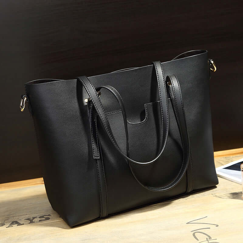Stylish black bucket shoulder bag, a versatile crossbody bag for modern individuals.