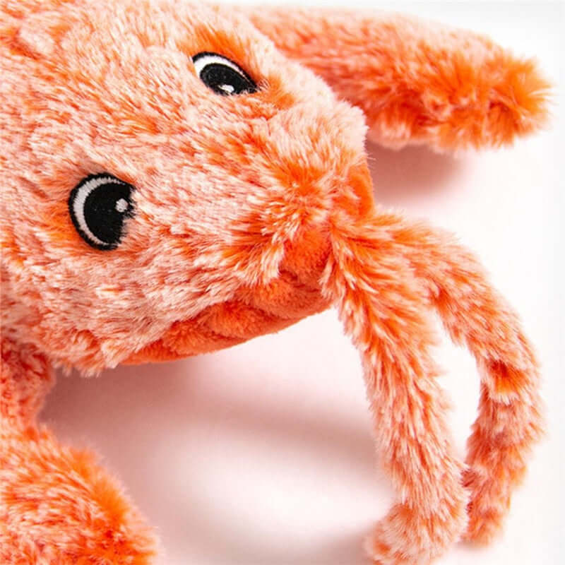 Interactive electric lobster pet toy with soft orange fur and cute facial features.