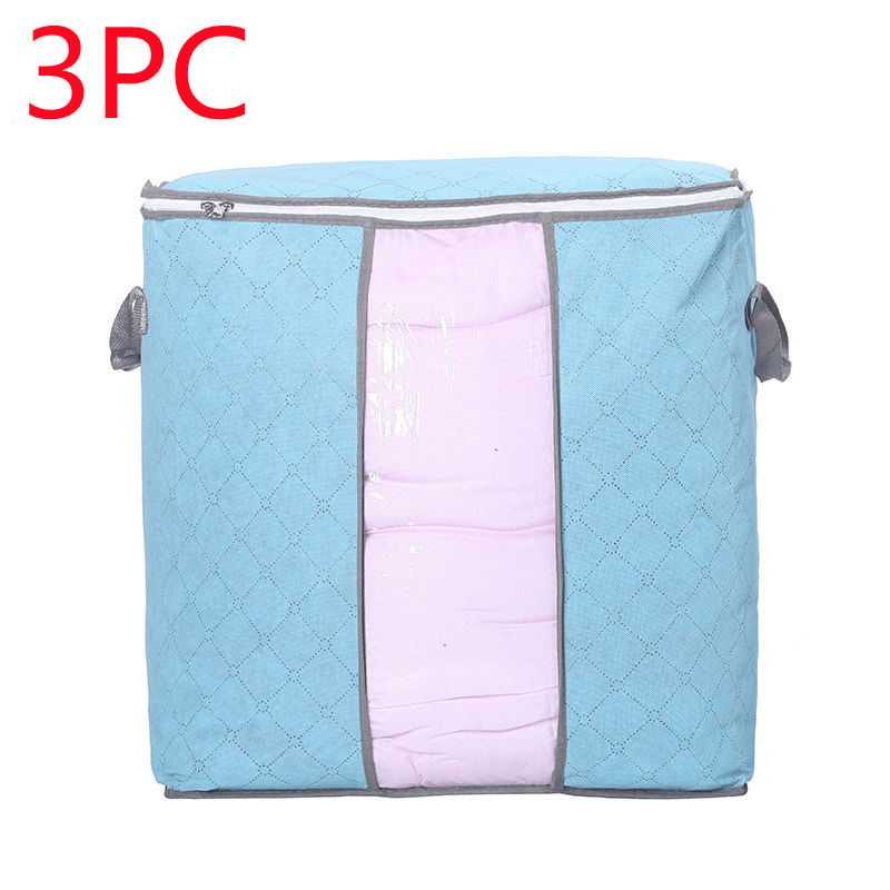 Storage Bag Quilt Storage Bag Moving Packing Bag Clothes Sorting Bag Clothing Duffel Bag in blue with pink interior.