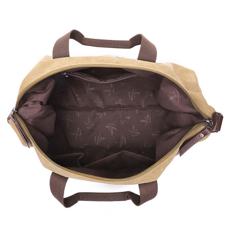 Interior view of a canvas crossbody travel bag showing ample space and zipper closure for storing essentials.