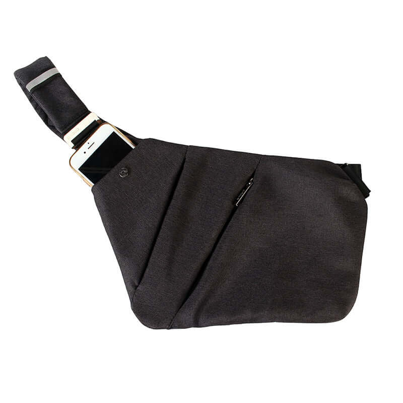 Versatile crossbody travel bag in black, featuring a stylish design and compartment for a smartphone.