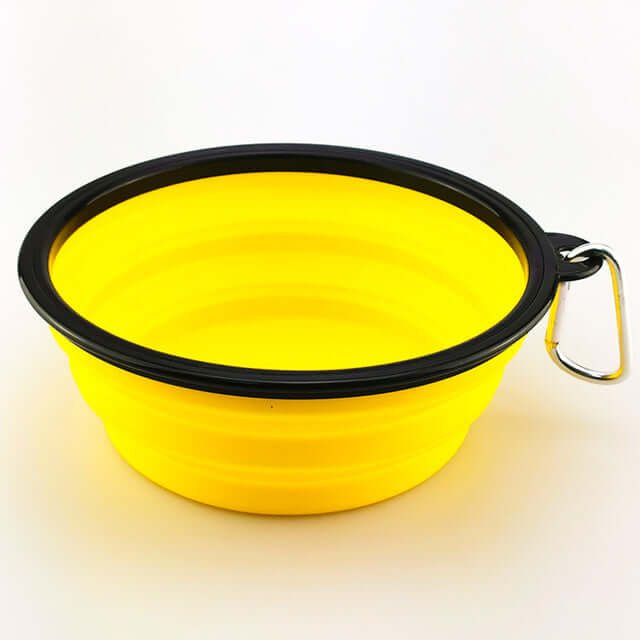 Collapsible pet bowl in bright yellow color, perfect for feeding pets on the go, made from high-quality silicone.