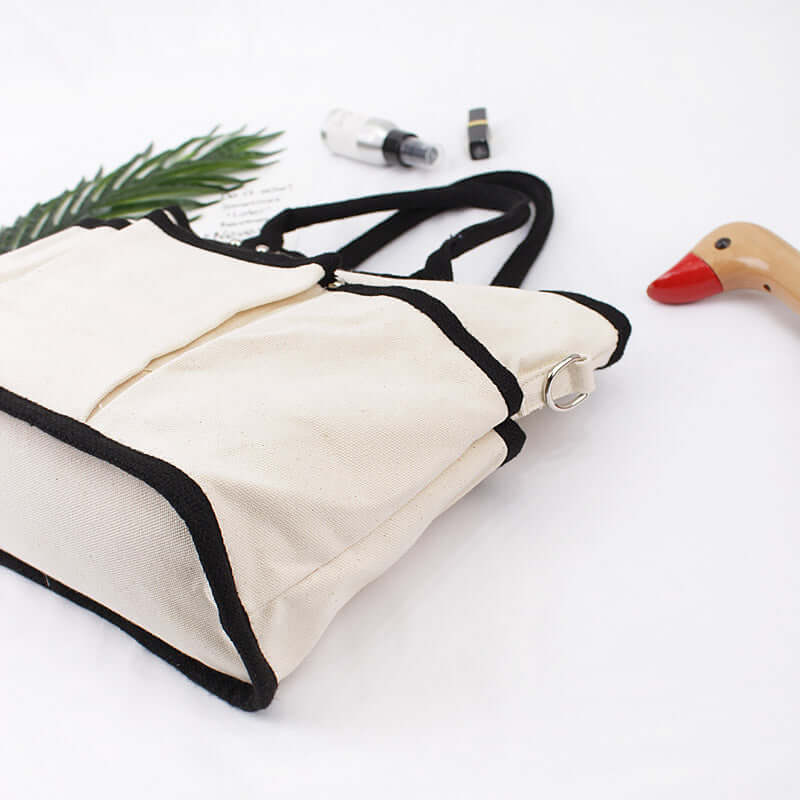 Shoulder Bag, Tote Bag, Crossbody Bag on a white background with a plant and a wooden duck toy.