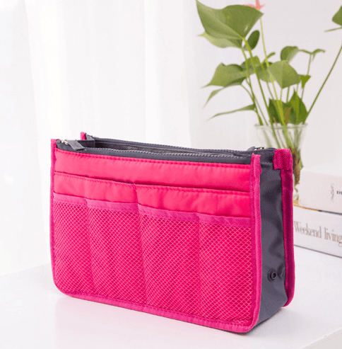Compact and stylish makeup organizer bag in pink, perfect for cosmetics and accessories storage.