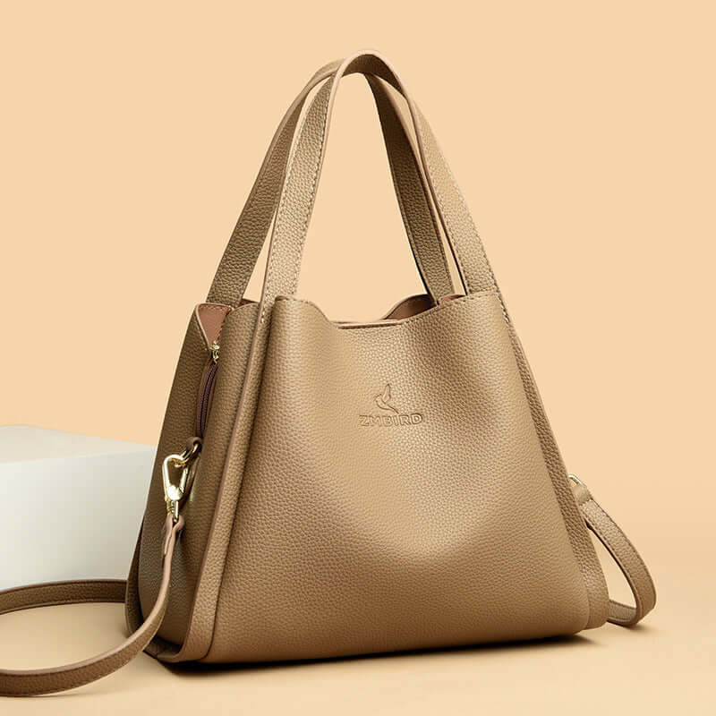 New women's crossbody tote bag in tan PU material, perfect for style and functionality.