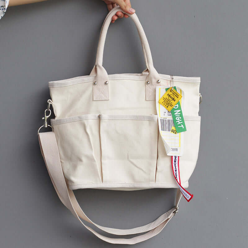 Stylish shoulder tote bag with detachable strap, showcasing a spacious interior and urban chic design.