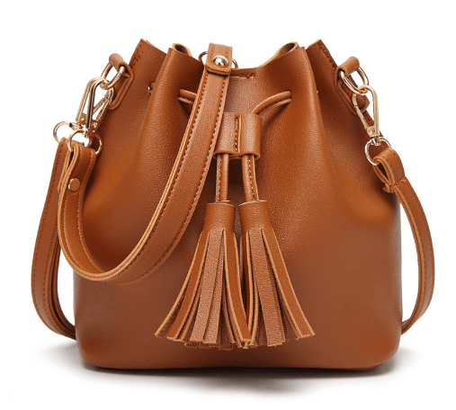 Stylish bucket bag in brown PU material featuring tassel details and adjustable crossbody strap.