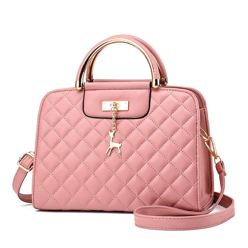 Fashionable pink quilted leather shoulder bag with gold accents and a cute charm, perfect for stylish outings.