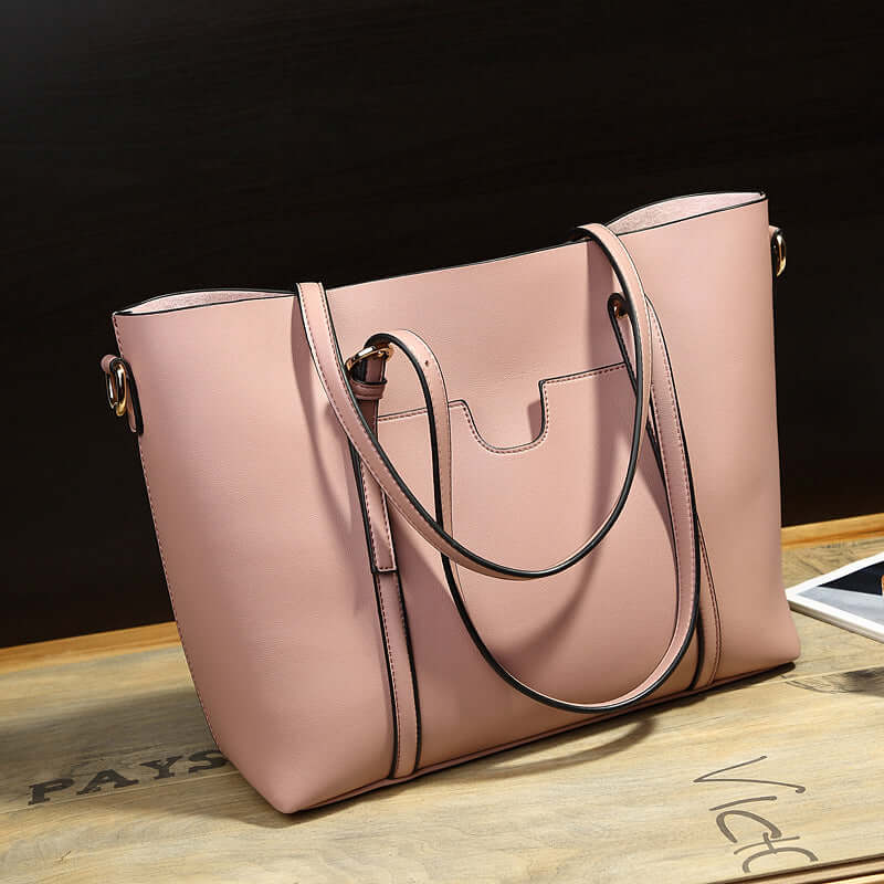 Shoulder Bag, Bucket Bag, Crossbody Bag in pink PU material showcasing a stylish design on wooden table.