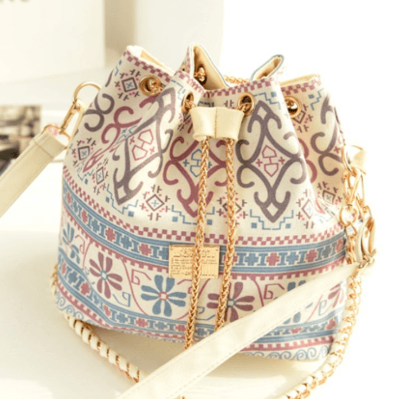 Ethnic style canvas bucket bag featuring unique patterns and a stylish chain strap.