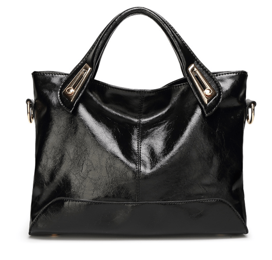 Chic crossbody bag in sleek black patent leather with elegant handles and gold accents, perfect for style and convenience.
