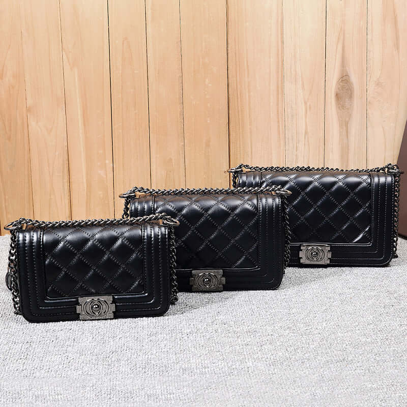 Stylish chain shoulder bag trio in black featuring quilted PU fabric and chain detail.
