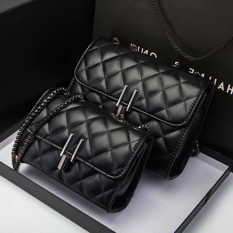 Trendy women's messenger handbag set in black with quilted design, perfect for fashion-forward women.