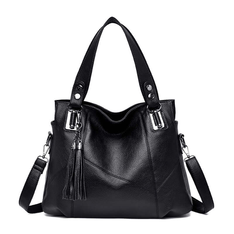 Fashionable soft leather large shoulder bag for women with tassel detail and spacious interior.