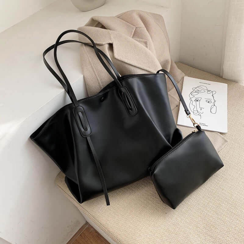 Stylish women's one shoulder handbag in black PU material with a matching pouch, perfect for any modern outfit.
