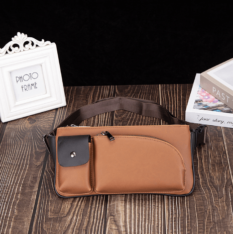 Versatile waist bag in stylish brown PU leather with multiple pockets and adjustable strap for comfort.